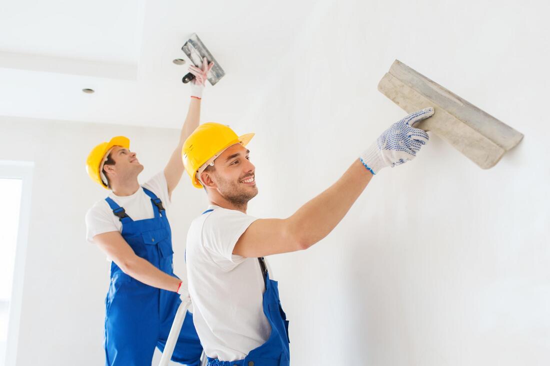 professional drywall contractors working on drywall repair 
